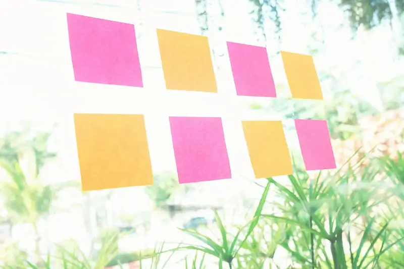 Sticky notes on a window - One way to cultivate gratitude with kids is to use sticky notes as a family for sharing gratitude